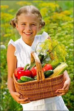 Garden vegetables and child